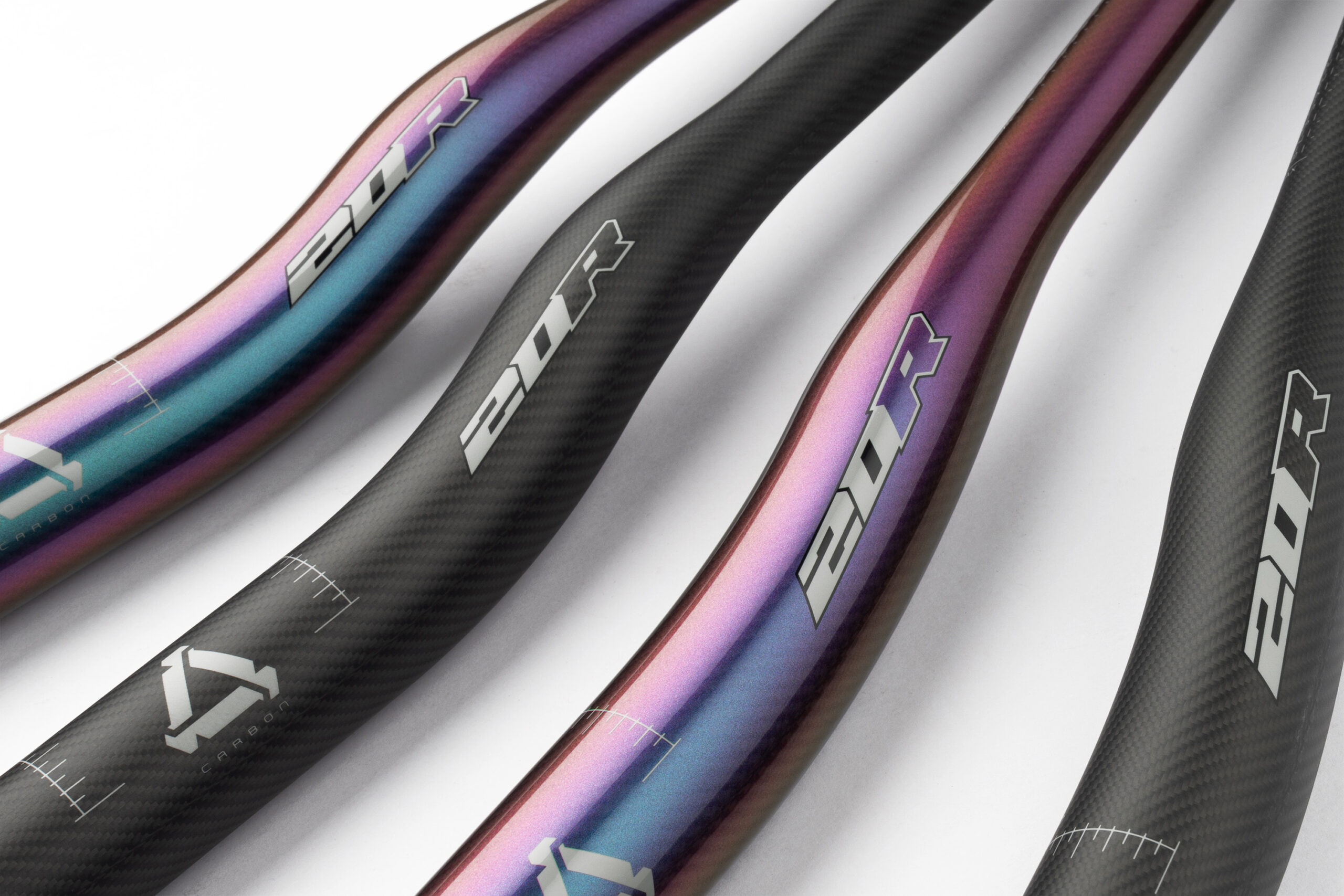 Hope carbon handlebars in standard black and chameleon finishes showing setup markings